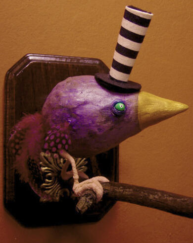 A fat purple bird in the shape of a teardrop, with beady yellow eyes, tiny feathered wings and tail, perched on a branch sprouting from a wooden plaque on the red wall background, and wearing a very very tall black and white striped tophat.